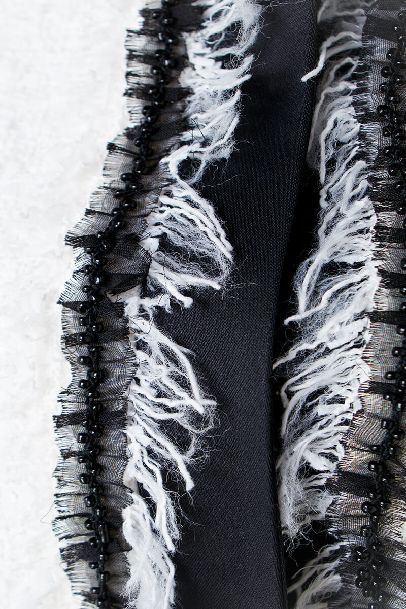 White tweed jacket with contrasting trim