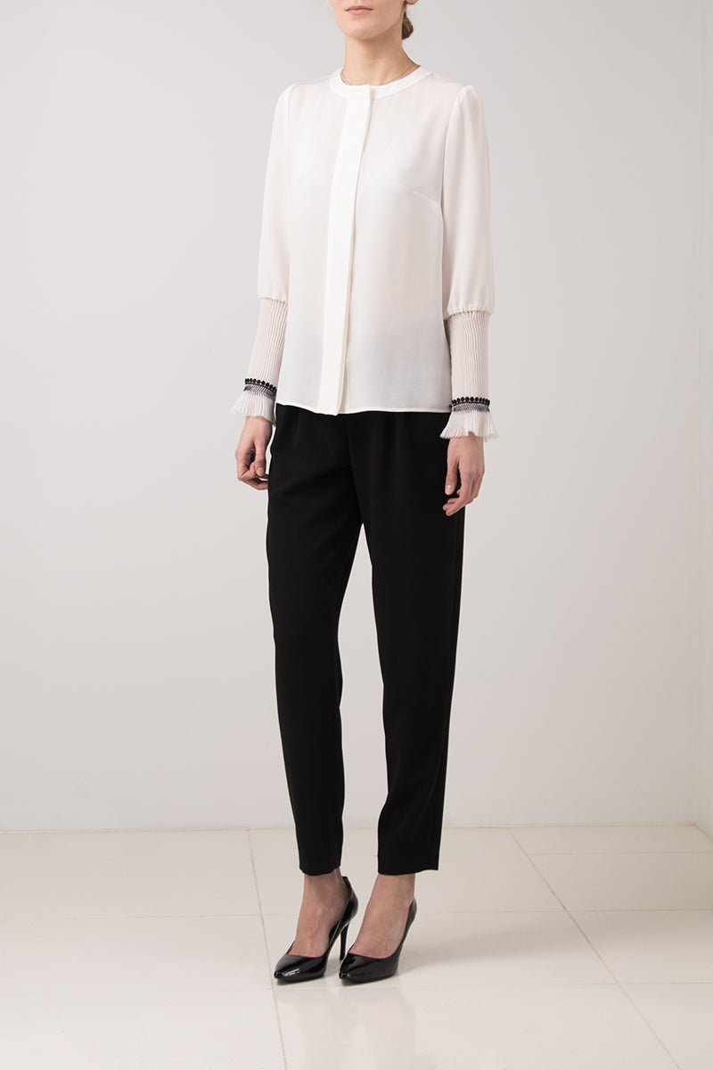 White silk blouse with gathered sleeves