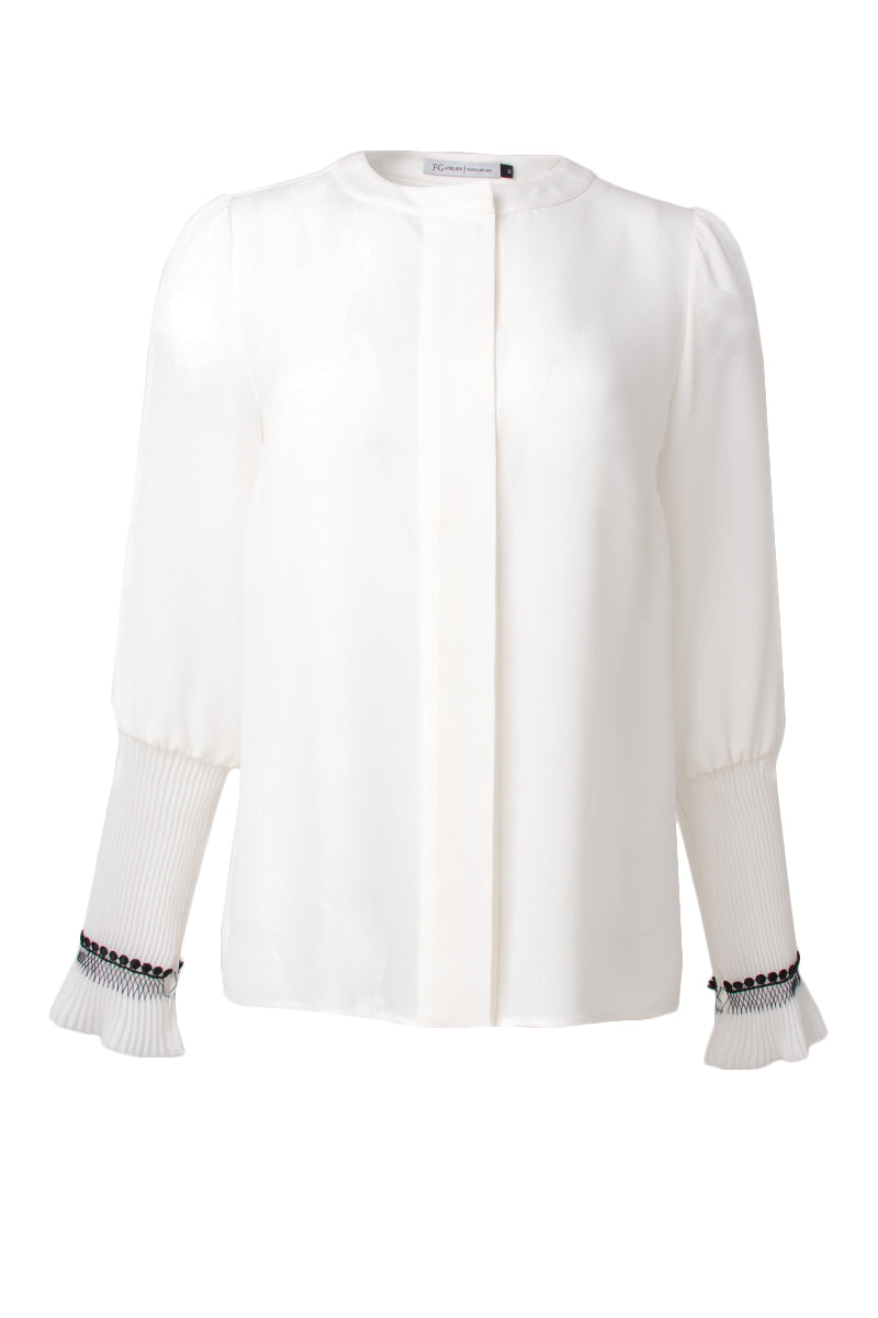 White silk blouse with gathered sleeves