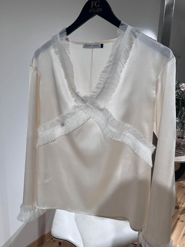 White sand stretch silk blouse with fringe detail