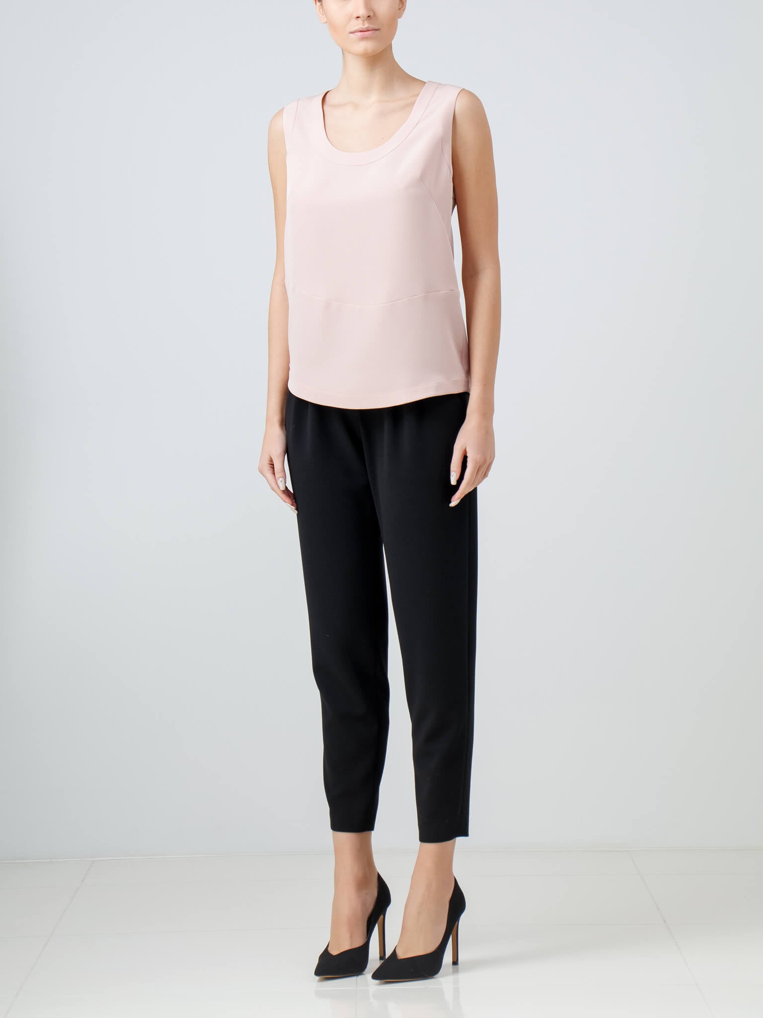 Light pink sleeveless asymmetric blouse